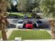 View of the parking area from the balcony, showing several parked cars at 616 River Oaks Dr. # 54F, Myrtle Beach, SC 29579