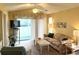 Living room with vaulted ceiling, sliding doors to balcony at 660 Tupelo Ln. # 7I, Longs, SC 29568