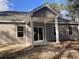 Back exterior view of a two-story home with covered patio at 1581 Highway 701 South, Loris, SC 29569