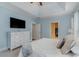 Main bedroom with mounted TV, walk-in closet and ensuite bathroom at 794 Thistle Trail, Calabash, NC 28467