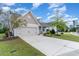 Two-story Craftsman home with front porch and attached two-car garage at 794 Thistle Trail, Calabash, NC 28467