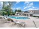 Community pool with lounge chairs and umbrellas at 794 Thistle Trail, Calabash, NC 28467