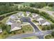 Aerial view of a cul-de-sac with houses and landscaping at 794 Thistle Trail, Calabash, NC 28467