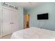 Light and airy bedroom with a double door closet and mounted TV at 794 Thistle Trail, Calabash, NC 28467
