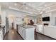 Modern kitchen with an island and view into adjacent living space at 794 Thistle Trail, Calabash, NC 28467