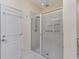 Bathroom with a large walk-in shower and tiled walls at 794 Thistle Trail, Calabash, NC 28467