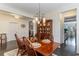 Bright dining room featuring a farmhouse table and view into kitchen at 794 Thistle Trail, Calabash, NC 28467