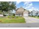 Tan house with blue door, garden, and driveway at 1356 Tranquility Ln., Myrtle Beach, SC 29577