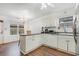 Bright kitchen featuring white cabinets and hardwood floors at 1356 Tranquility Ln., Myrtle Beach, SC 29577