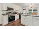 Modern kitchen with stainless steel appliances and an island at 1356 Tranquility Ln., Myrtle Beach, SC 29577
