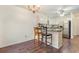 Inviting kitchen with breakfast bar and stainless steel fridge at 1356 Tranquility Ln., Myrtle Beach, SC 29577
