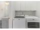 Bright laundry room with washer, dryer, and cabinets at 500 Willow Greens Dr. # B, Conway, SC 29526