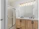 Modern bathroom with double vanity, updated light fixtures, and a shower at 500 Willow Greens Dr. # B, Conway, SC 29526