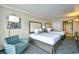 Two beds and an armchair in bedroom at 1105 S Ocean Blvd. # 1044, Myrtle Beach, SC 29577