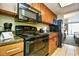 Kitchen with stove, microwave, and granite countertop at 1105 S Ocean Blvd. # 1044, Myrtle Beach, SC 29577