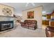 Cozy living room featuring a stone fireplace and a leather reclining sofa at 3570 Cluster Ln., Myrtle Beach, SC 29579