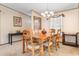 Bright dining area featuring a wood table and six chairs at 3570 Cluster Ln., Myrtle Beach, SC 29579