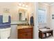 Small bathroom with pedestal sink and block window at 512 Goff Creek Ct., Myrtle Beach, SC 29579