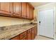 Convenient laundry room with granite countertop and ample cabinetry at 512 Goff Creek Ct., Myrtle Beach, SC 29579