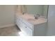 Double vanity bathroom with white cabinets and tiled floors at 6060 Zoe Way, Myrtle Beach, SC 29588