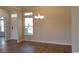 Spacious dining room with hardwood floors and chandelier at 6060 Zoe Way, Myrtle Beach, SC 29588