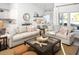 Spacious living room features two sofas, a coffee table, and kitchen views at 6088 Zoe Way, Myrtle Beach, SC 29588