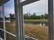 Screened porch with peaceful water views at 6088 Zoe Way, Myrtle Beach, SC 29588