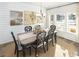 Charming dining room features a farmhouse table and shiplap walls at 6088 Zoe Way, Myrtle Beach, SC 29588