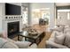 Open living room with fireplace, comfortable seating, and adjacent dining area at 6088 Zoe Way, Myrtle Beach, SC 29588