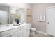 Double vanity bathroom with white cabinets and a large mirror at 5042 Selene Ct., Myrtle Beach, SC 29588