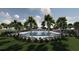 Community pool surrounded by palm trees and lounge chairs at 5042 Selene Ct., Myrtle Beach, SC 29588