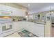 Well-equipped kitchen with white cabinets and granite countertops at 601 Hillside Dr. N # 3906, North Myrtle Beach, SC 29582