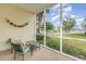 Screened porch overlooking a pond with water views and lush landscaping at 601 Hillside Dr. N # 3906, North Myrtle Beach, SC 29582