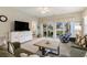 Living room with sectional sofa and view of water from sliding doors at 601 Hillside Dr. N # 3906, North Myrtle Beach, SC 29582