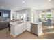 Open-concept kitchen with island, stainless steel appliances, and water views at 5050 Selene Ct., Myrtle Beach, SC 29588