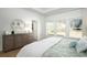 Bedroom with large windows, dresser, and neutral decor at 5054 Selene Ct., Myrtle Beach, SC 29588
