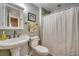 Clean bathroom with pedestal sink, toilet, and shower/tub combo at 233 Banbury Ln. # 401, Little River, SC 29566