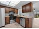 Updated kitchen featuring granite countertops and wood cabinets at 1301 Pridgen Rd. # 1008, Myrtle Beach, SC 29577