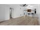 Open living area with wood-look floors and kitchen bar at 1301 Pridgen Rd. # 1008, Myrtle Beach, SC 29577