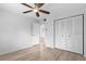 Bedroom with double door closet and wood-look floors at 1301 Pridgen Rd. # 1008, Myrtle Beach, SC 29577