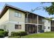 Exterior view of building with screened porch and landscaping at 1301 Pridgen Rd. # 1008, Myrtle Beach, SC 29577