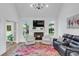 Cozy living room featuring a fireplace, hardwood floors, and ample natural light at 2150 North Berwick Dr., Myrtle Beach, SC 29575