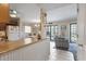 Kitchen features a breakfast bar and open concept to the living area at 5905 S Kings Highway # 219-B, Myrtle Beach, SC 29575