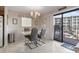 Dining area with table for four and access to a balcony at 5905 S Kings Highway # 219-B, Myrtle Beach, SC 29575