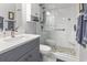 Updated bathroom with a walk-in shower and gray vanity at 5905 S Kings Highway # 219-B, Myrtle Beach, SC 29575
