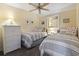 Bedroom with twin beds, dresser and coastal decor at 5905 S Kings Highway # 219-B, Myrtle Beach, SC 29575