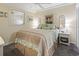 Light and airy bedroom with a queen-size bed and coastal decor at 5905 S Kings Highway # 219-B, Myrtle Beach, SC 29575