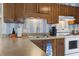 Cozy kitchen features wood cabinets, and updated countertops at 5905 S Kings Highway # 219-B, Myrtle Beach, SC 29575