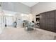 Bright dining area with a table and chairs, kitchen pass-through, and built-in wall unit at 4755 Lightkeepers Way # 15-F, Little River, SC 29566