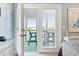 Bedroom with access to a private balcony overlooking marina at 4755 Lightkeepers Way # 15-F, Little River, SC 29566